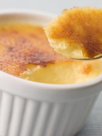 A closeup of a spoonful of Crème Brulee.