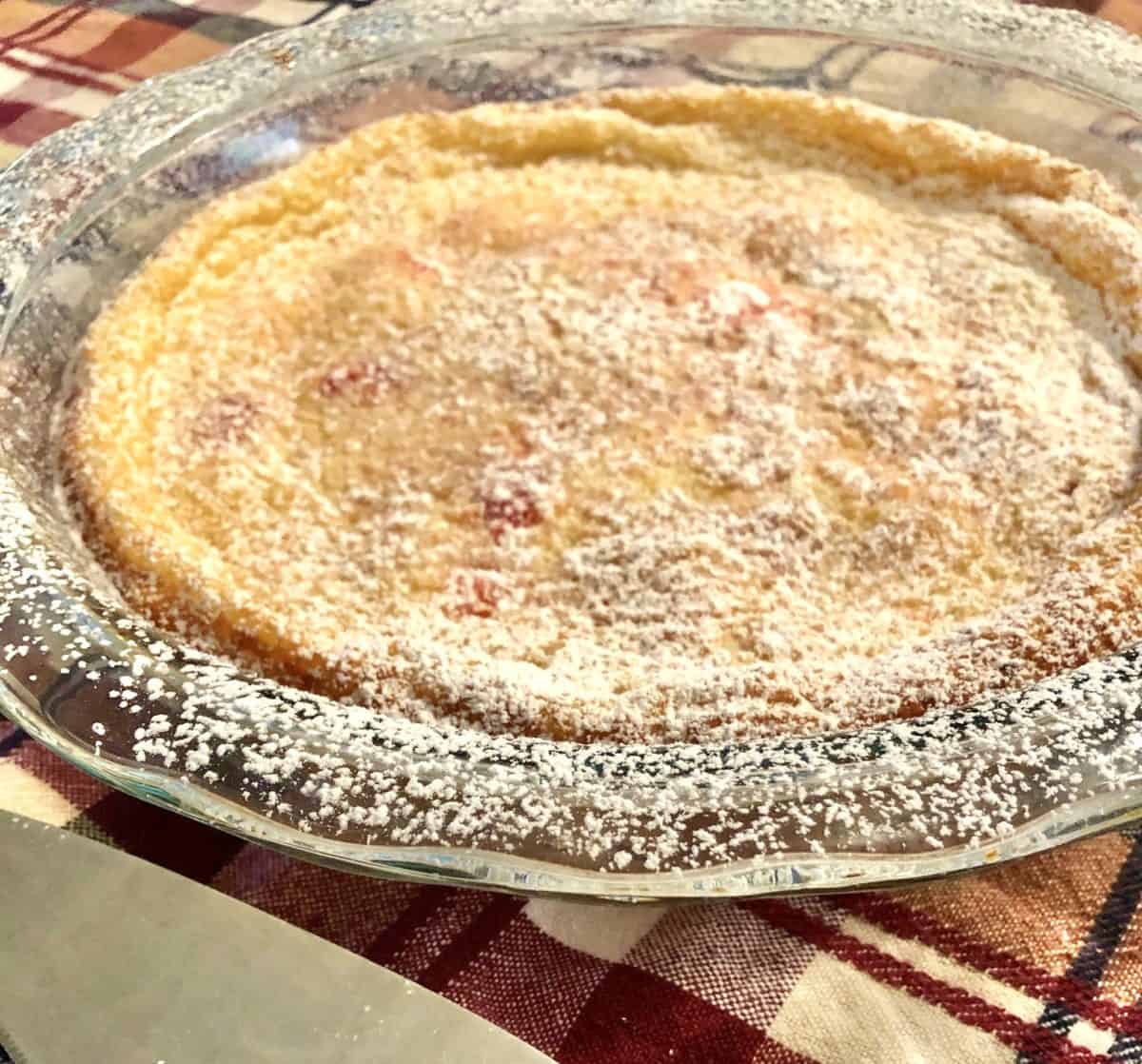 A closeup of simple French cherry clafoutis on the table.