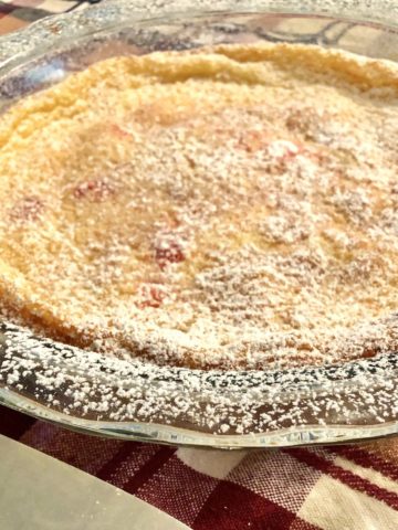 A closeup of simple French cherry clafoutis on the table.