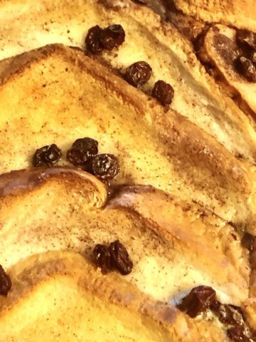 A close up of bread and butter pudding dessert.