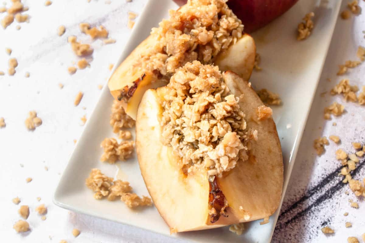 A close up of the best oatmeal baked apples on a serving dish.
