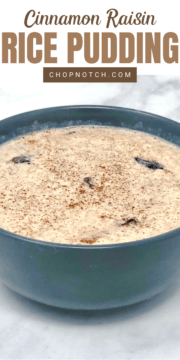 Cinnamon raisin rice pudding in a bowl on a table.