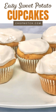 Several sweet potato cupcakes with marshmallow frosting on a plate.