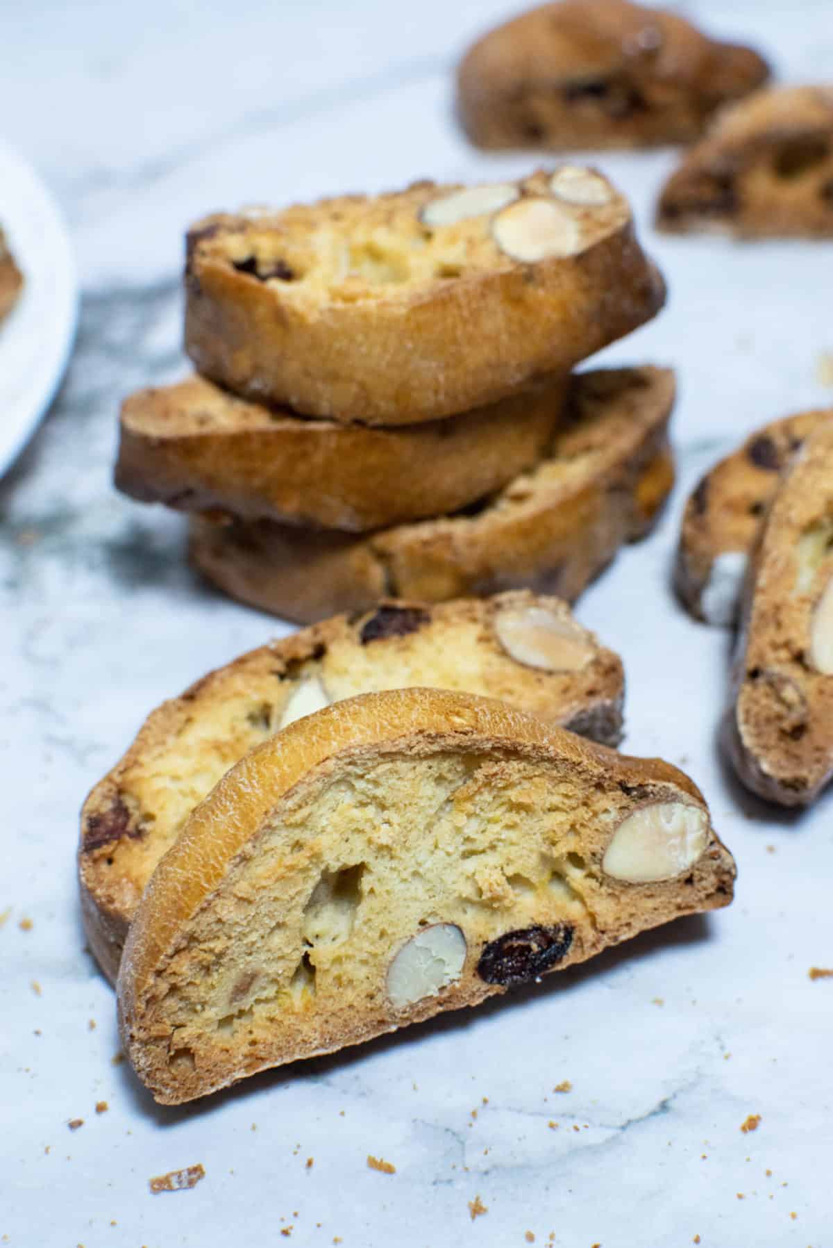 A stack of Italian cranberry almond biscotti on a table.