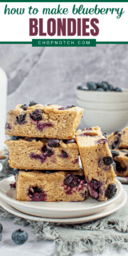 Blueberry blondies staked on a plate.