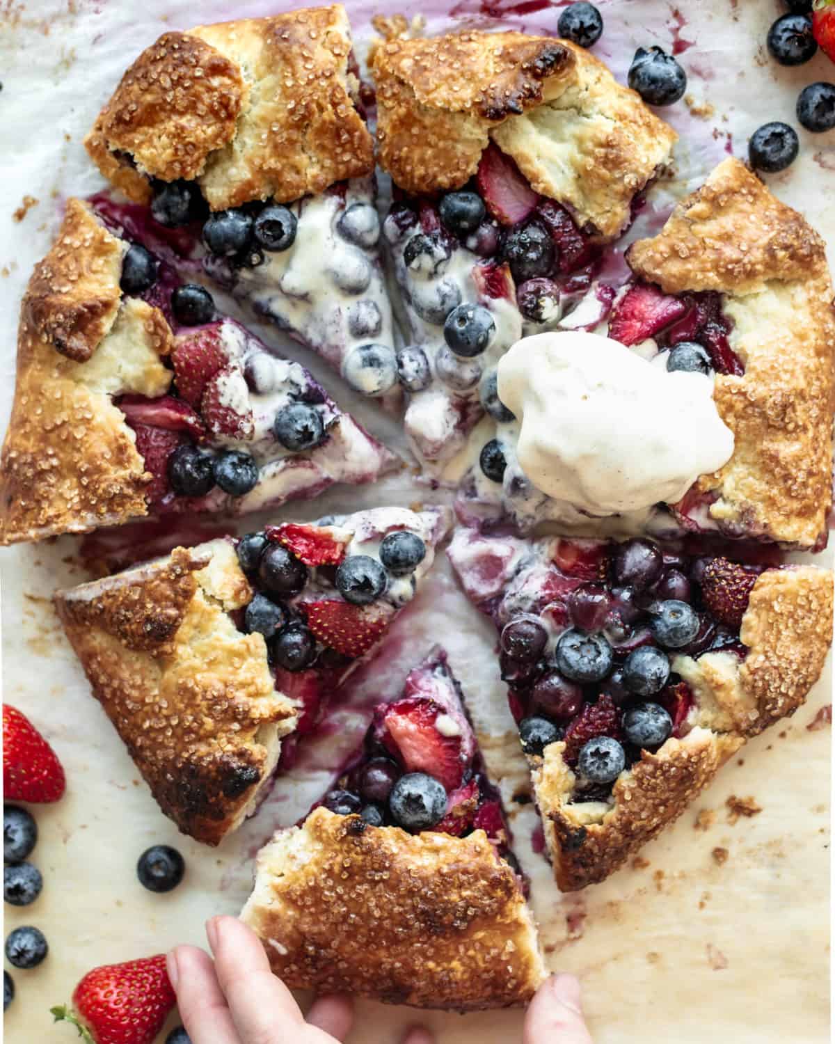 Blueberry and strawberry pie on a table.