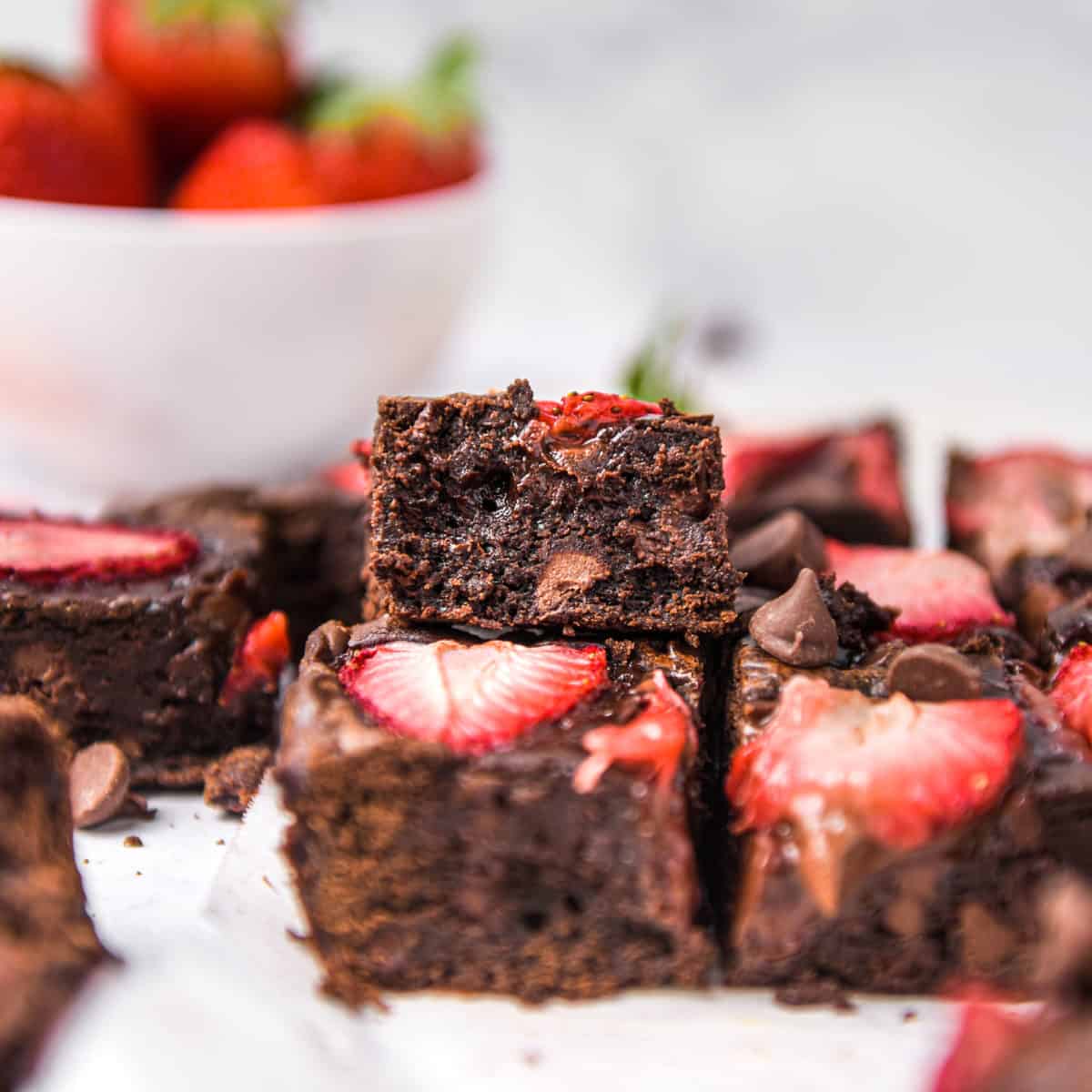 Brownies with chunks of strawberry in them.