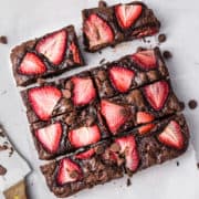 Brownies with strawberries cut and ready to serve.