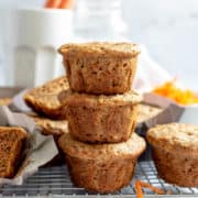 Carrot banana muffins stacked on each other.