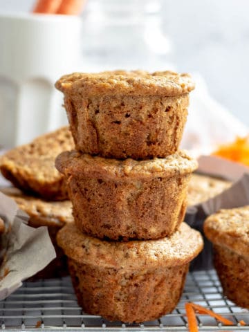 Carrot banana muffins stacked on each other.