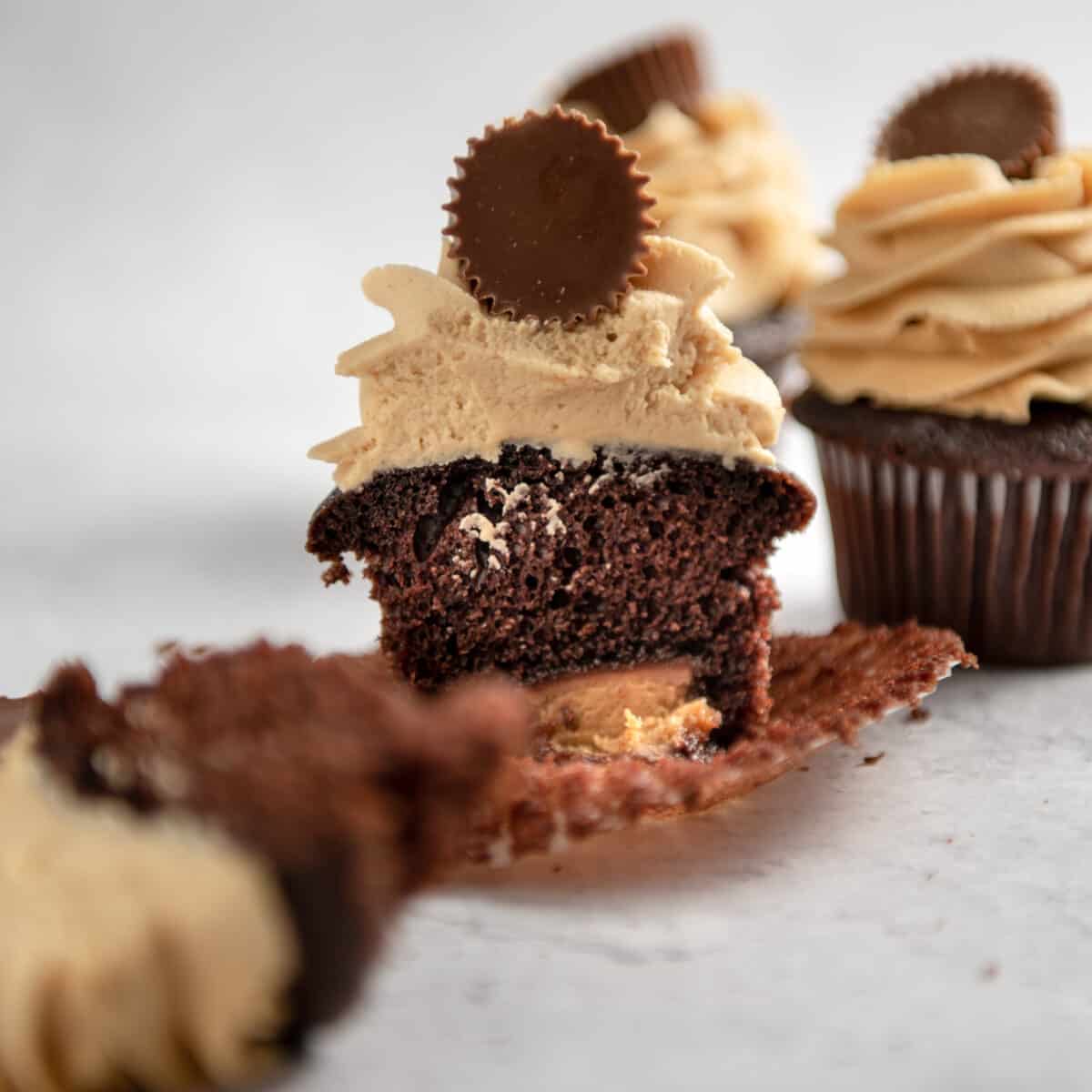 A melted Reese's candy instead the center of a chocolate cupcake.