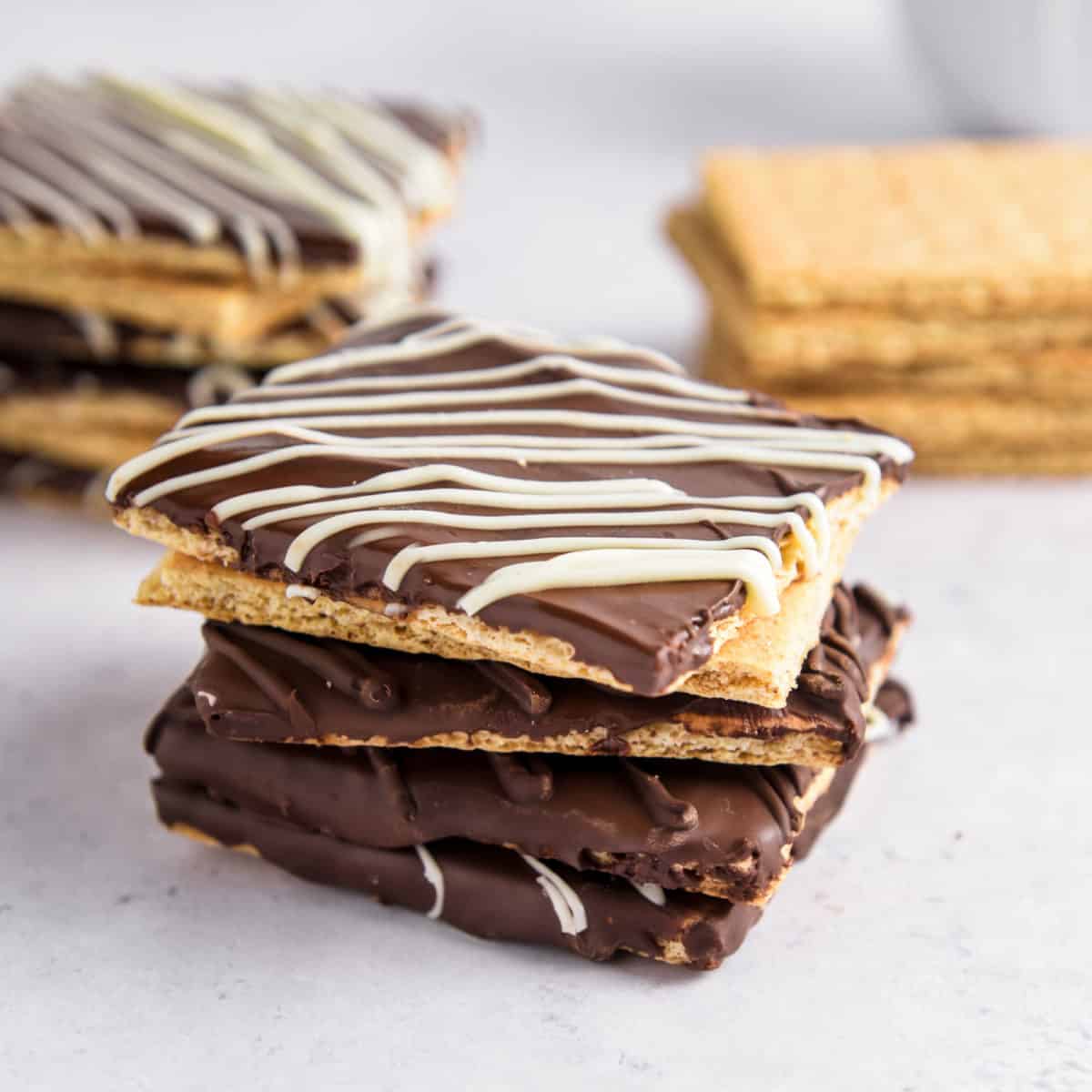 Chocolate grahams with white chocolate drizzled on top.