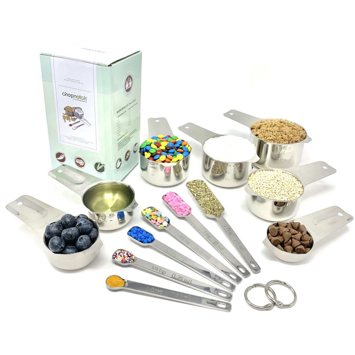 The measuring cups and spoons spread out and filled with ingredients.