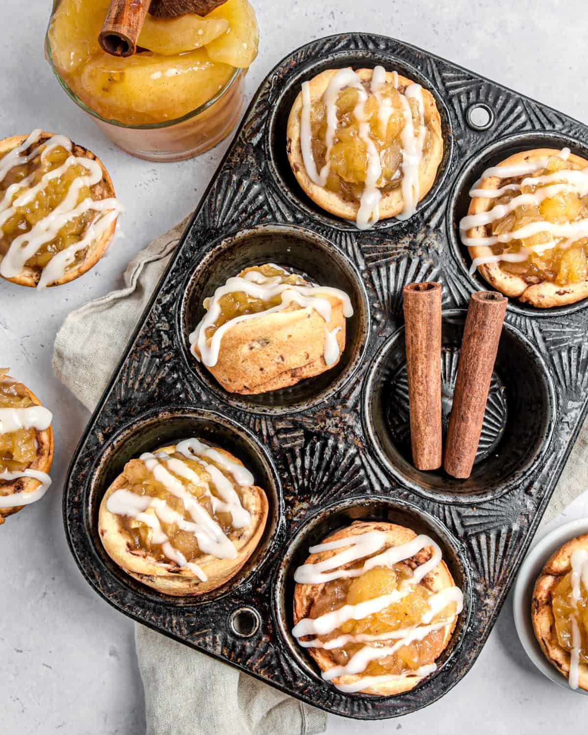 Apple pie cups in a muffin tin.