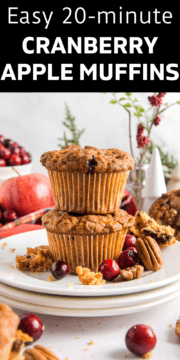 Apple cranberry muffins stacked on top of each other.