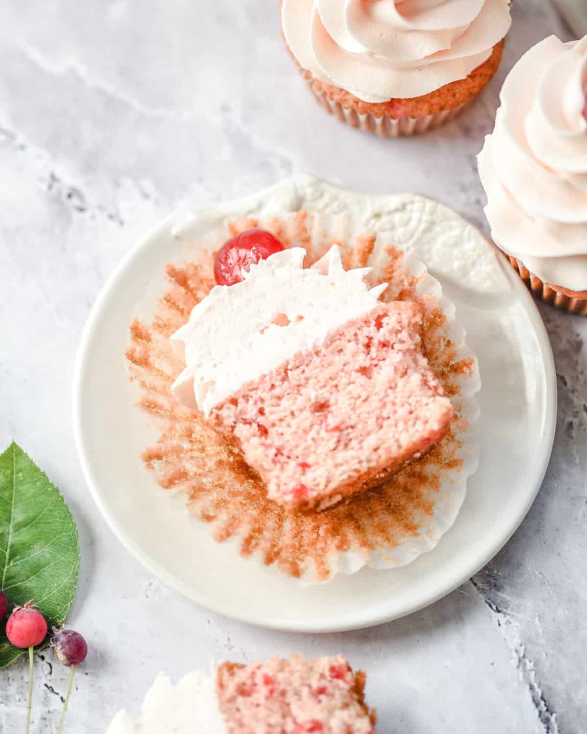 Overhead shot of a cupcake sliced in half showing its inside.