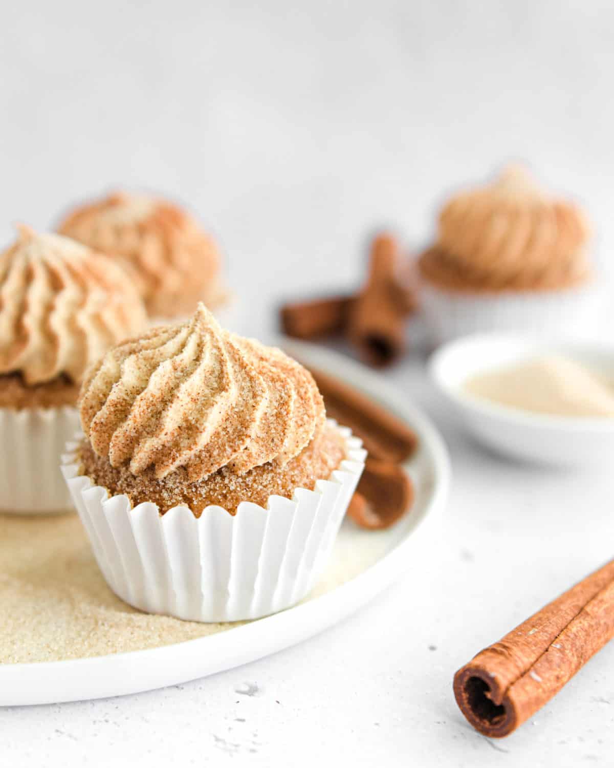 Buttercream frosting on a cinnamon cupcake.