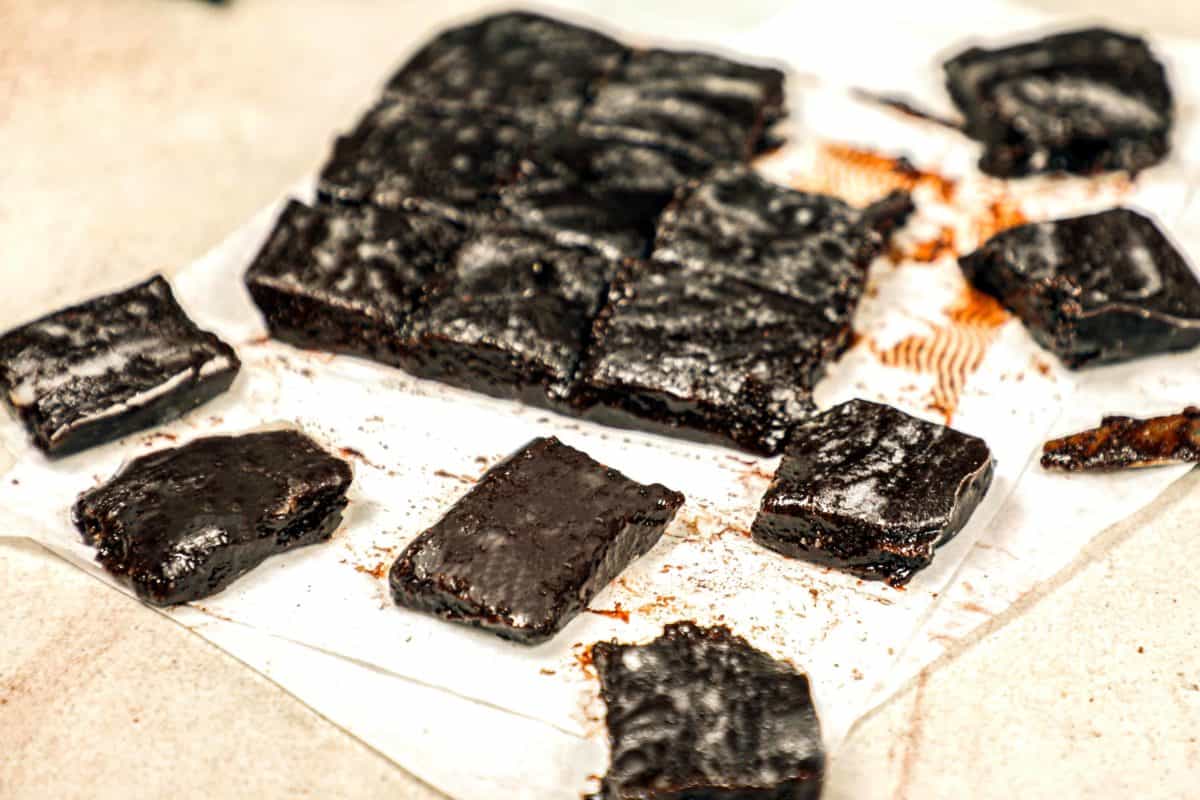 Square cut pieces of dark chocolate fudge.