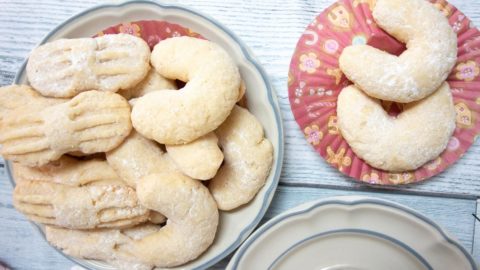 Coconut moon cookies on a plate.