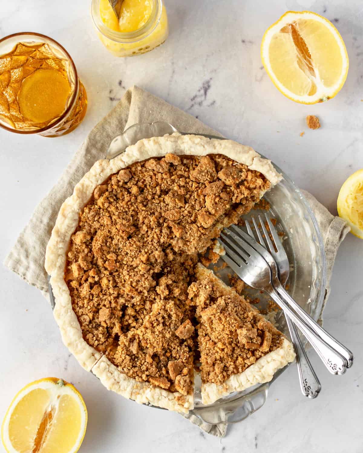 A lemon crunch pie in its dish with a slice cut out.