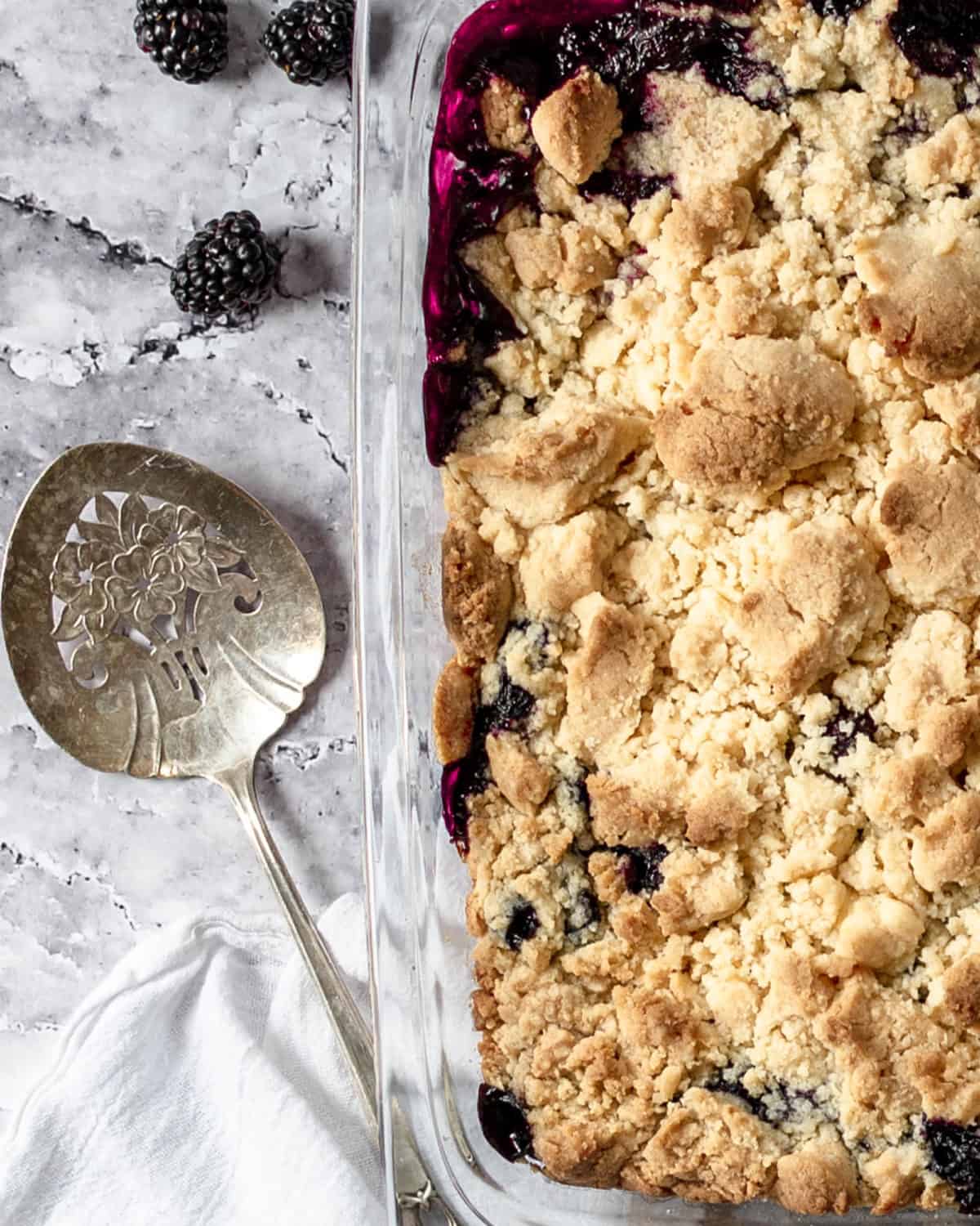 Close up of blackberry cobbler finished in a baking dish.