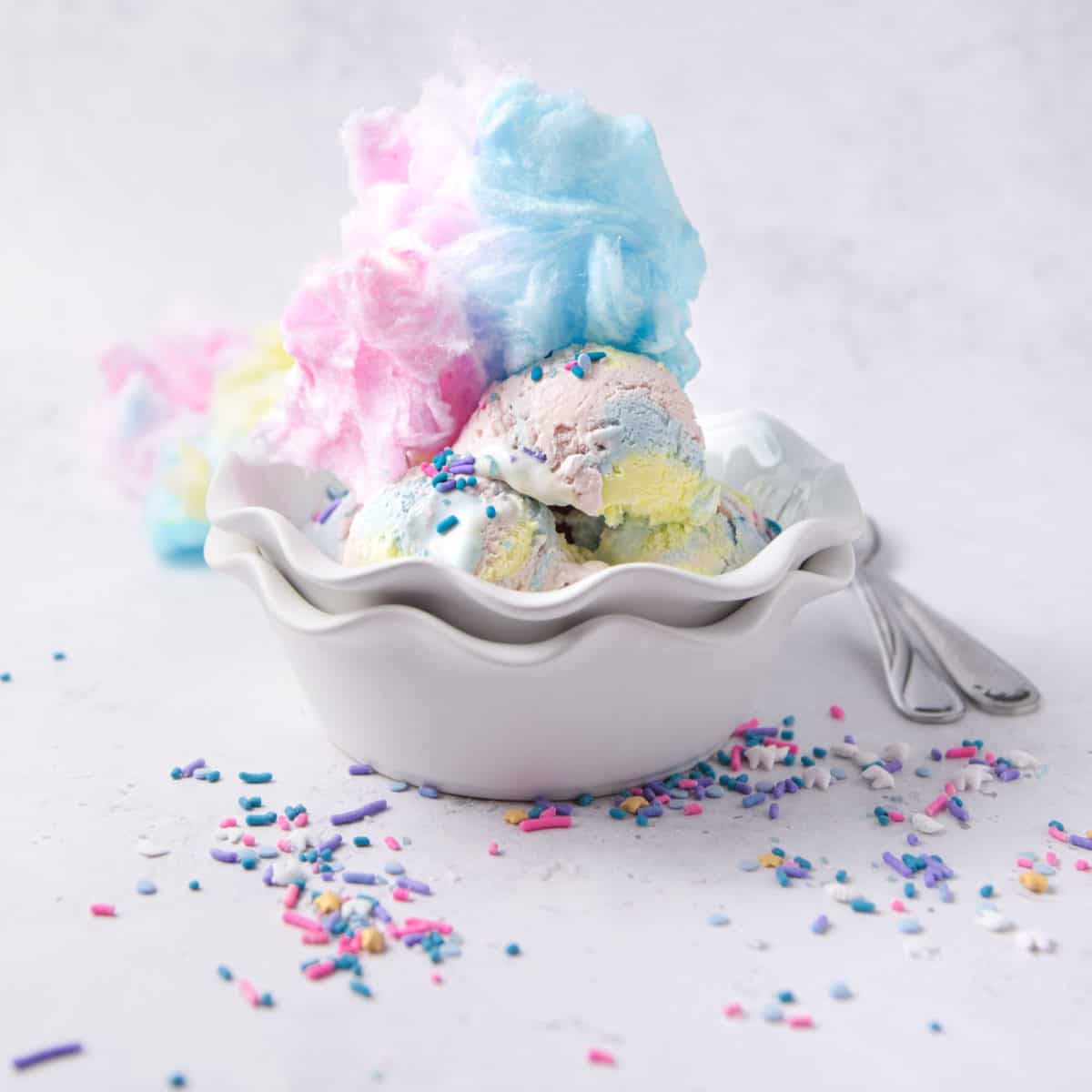 A bowl of homemade ice cream with cotton candy on top.