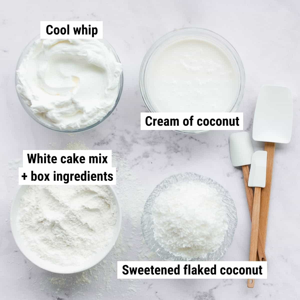 The ingredients to make coconut poke cake laid out on a table.