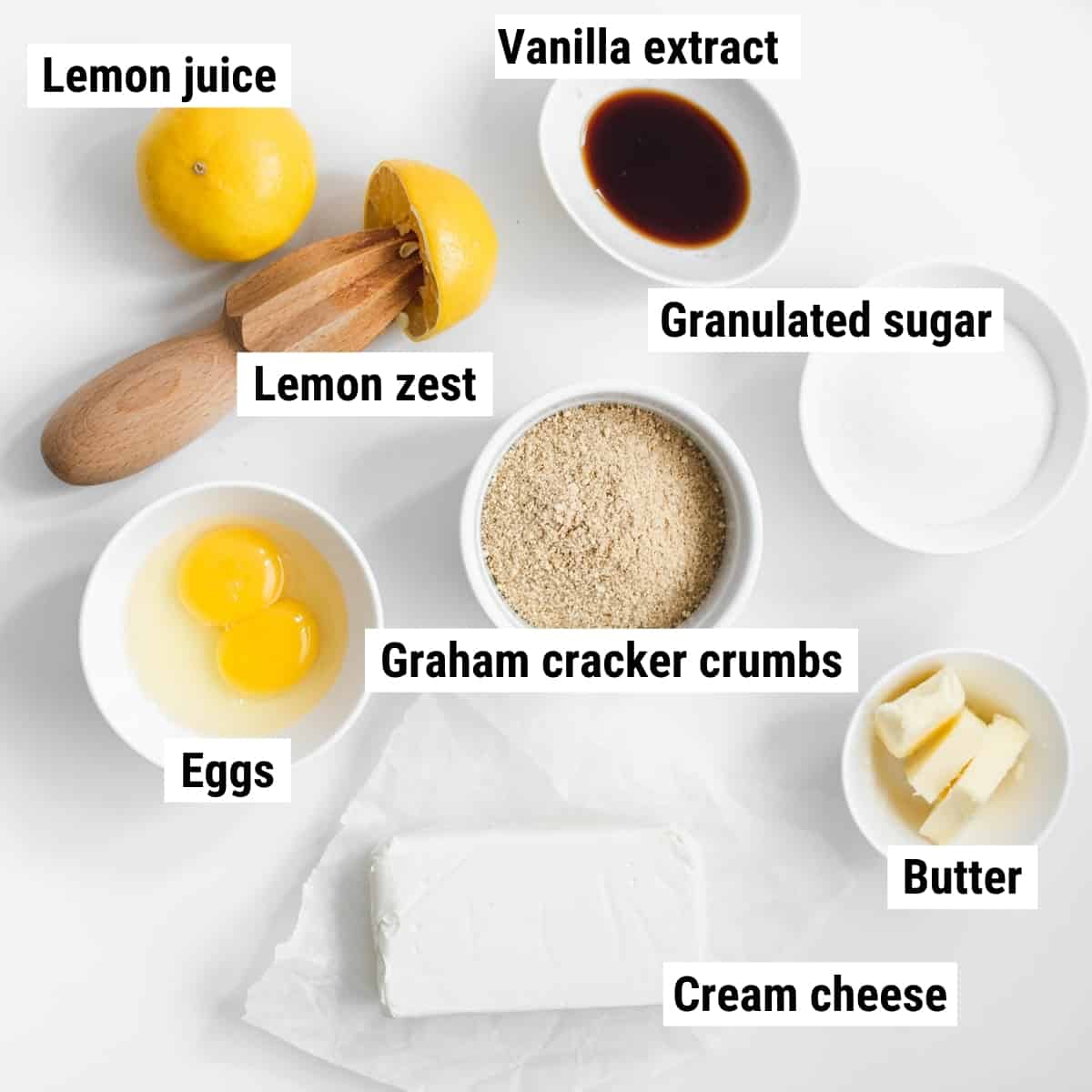 The ingredients on a table to make mini lemon cheesecakes.