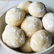 Several Italian wedding cookies in a bowl.