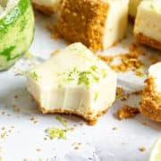 A piece of key lime fudge with a bite taken out of it.