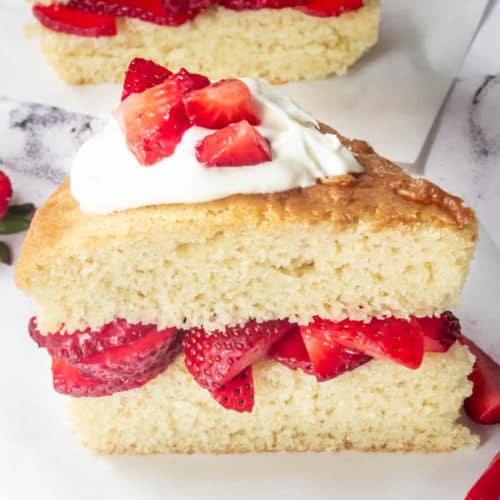 A slice of layered strawberry shortcake.