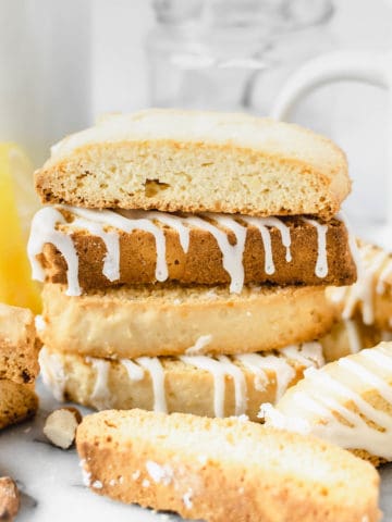 Several lemon biscotti stacked on each other.