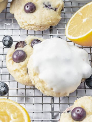 Blueberry cookies with lemon on a cooling rack.