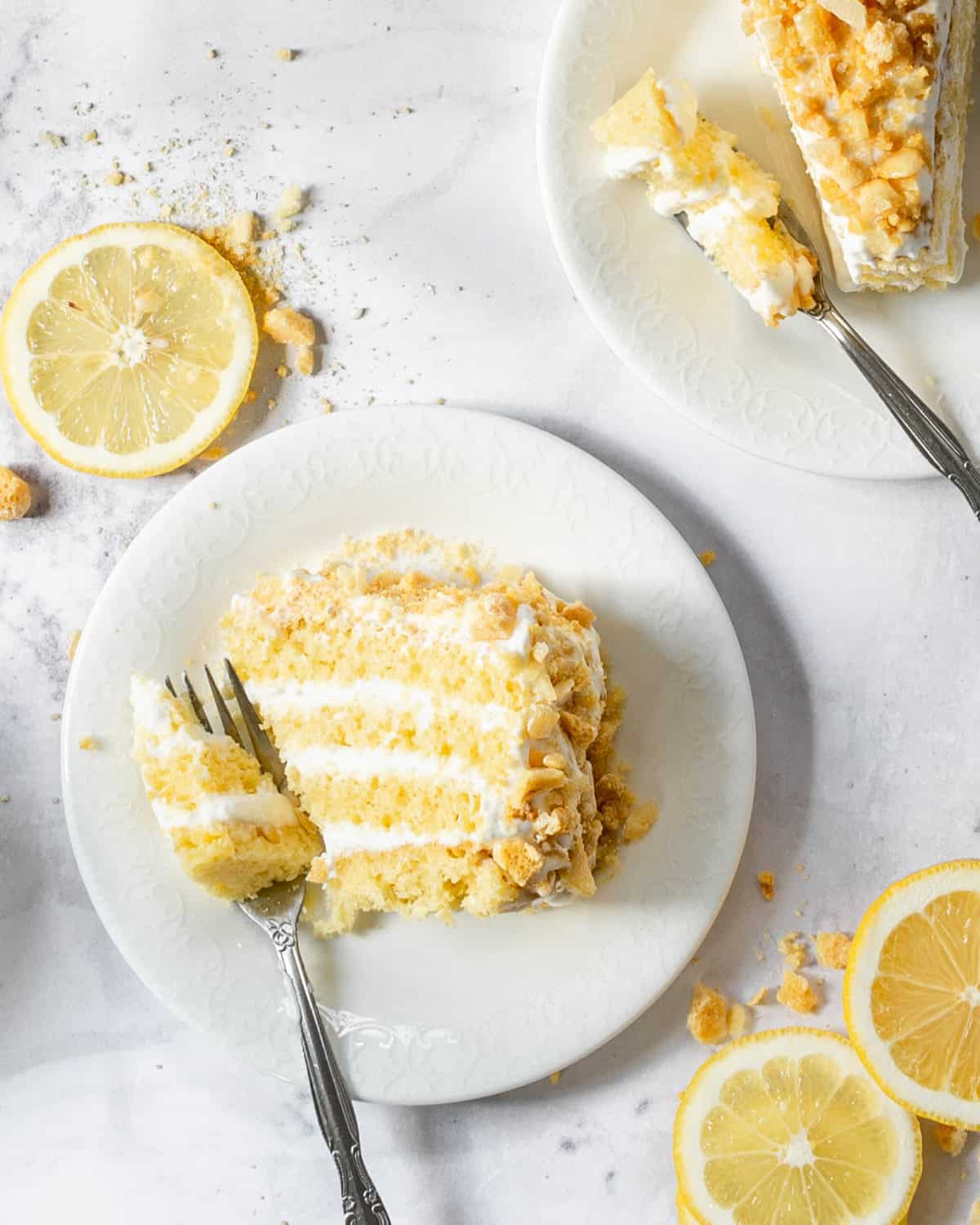 A slice of lemon crunch cake on a plate.