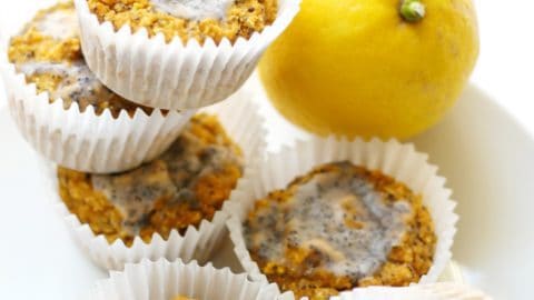 Lemon poppy seed muffins stacked on each other.
