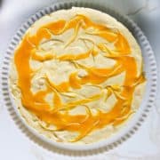 A no-bake mango cheesecake overhead shot.