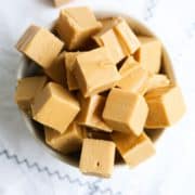 Several chunks of fresh maple fudge in a bowl.