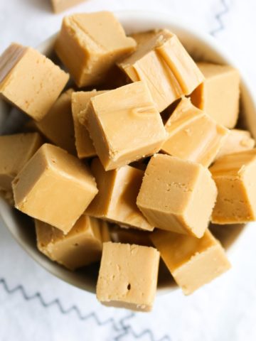 Several chunks of fresh maple fudge in a bowl.