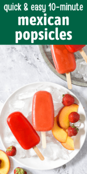 Mexican popsicles on ice with fresh fruit.
