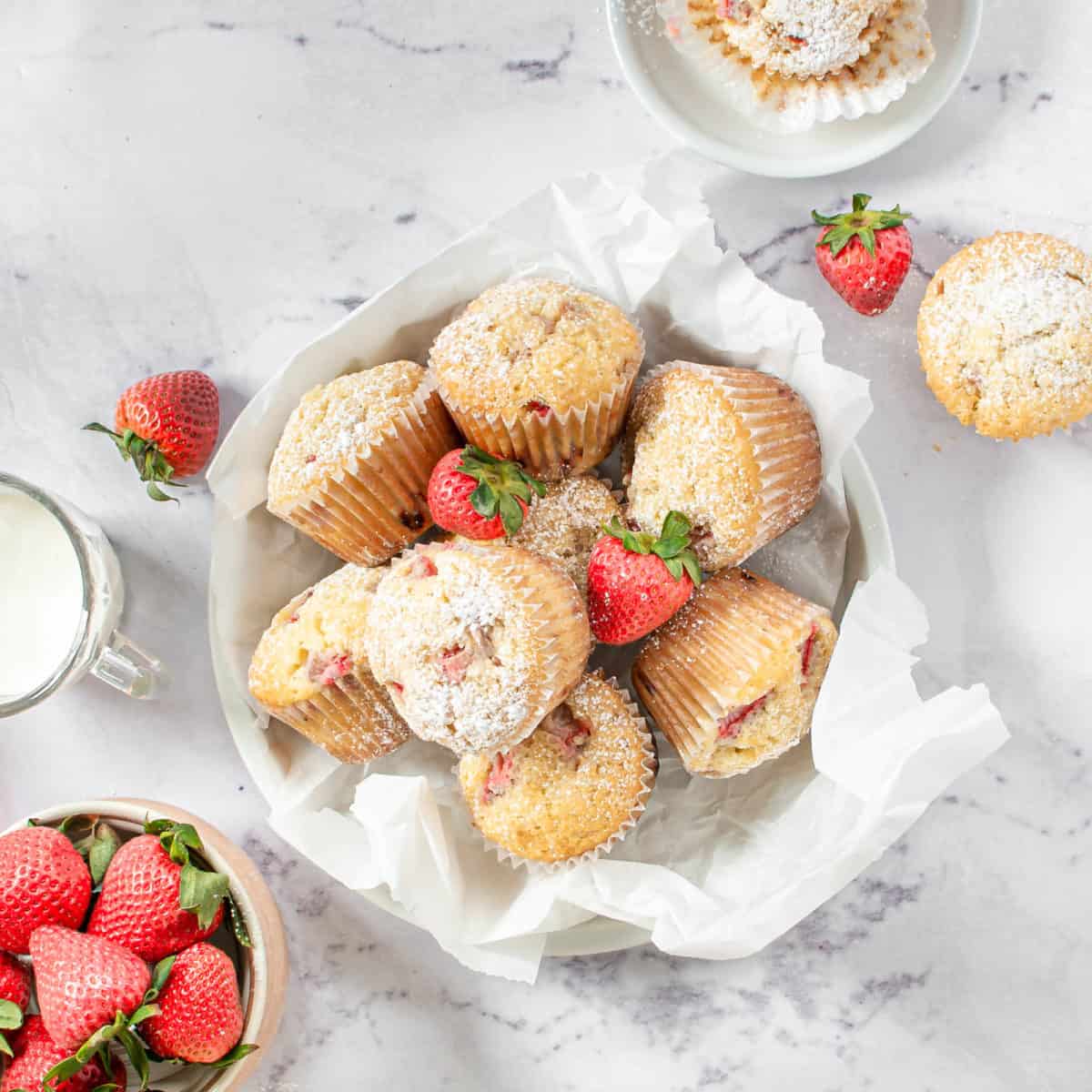A bowl of strawberry lemon muffins.