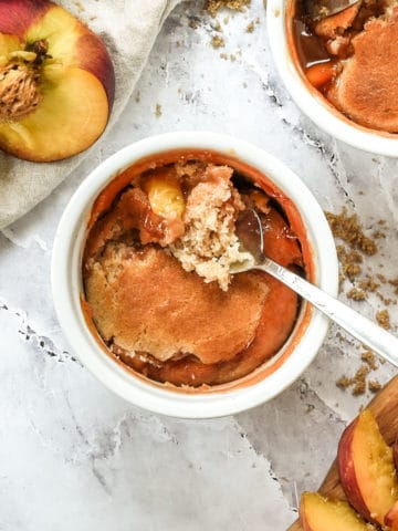 Two bowls of peach cobbler.