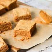 Peanut butter blondies spread out on a table.