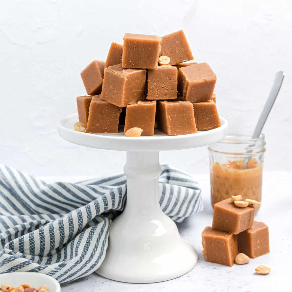 Square pieces of fudge on a stand ready to serve.