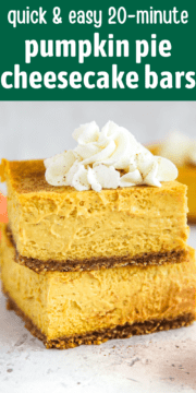 Pumpkin pie cheesecake bars stacked on a table and topped with whipped cream.