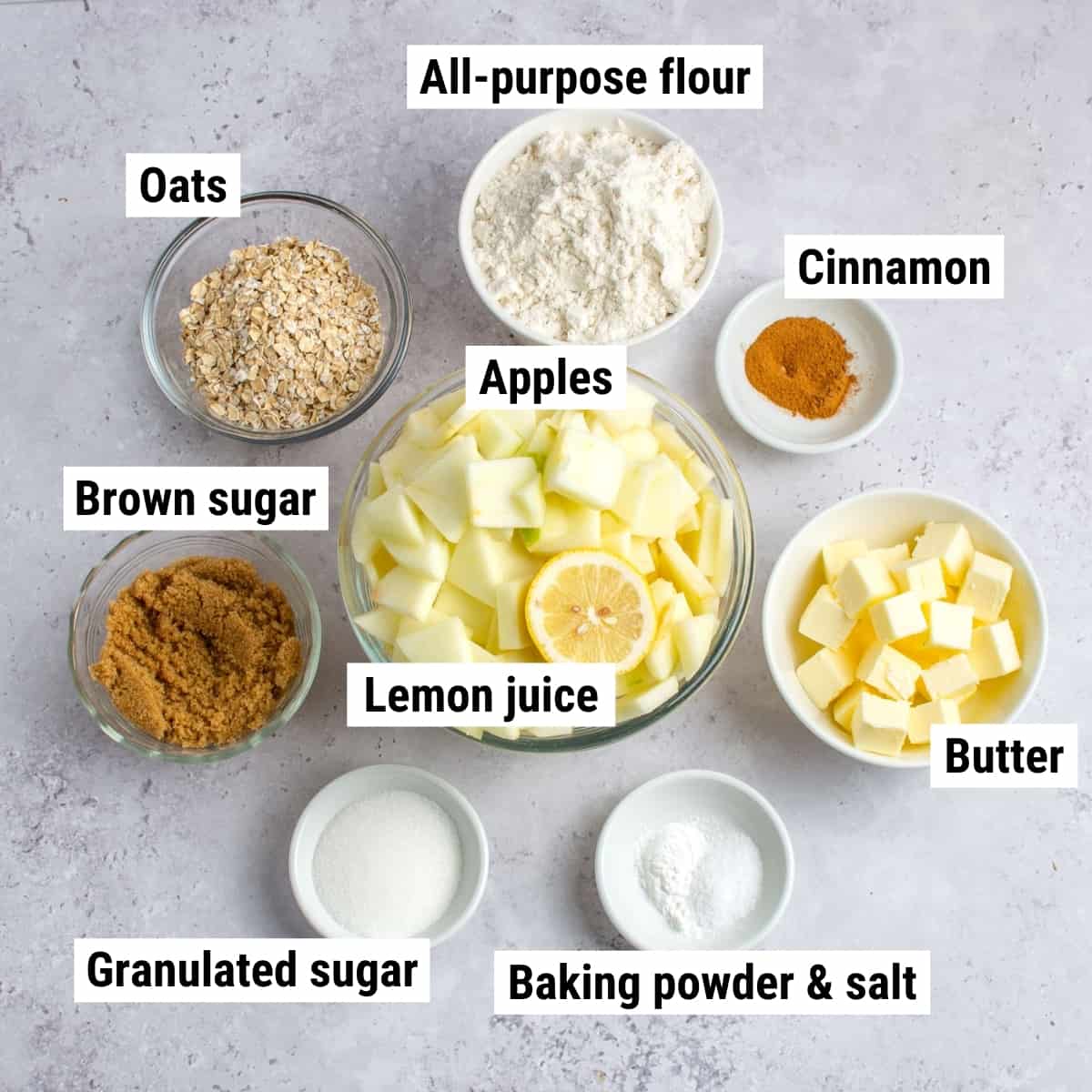 The ingredients to make apple crisp bars laid out on a table.