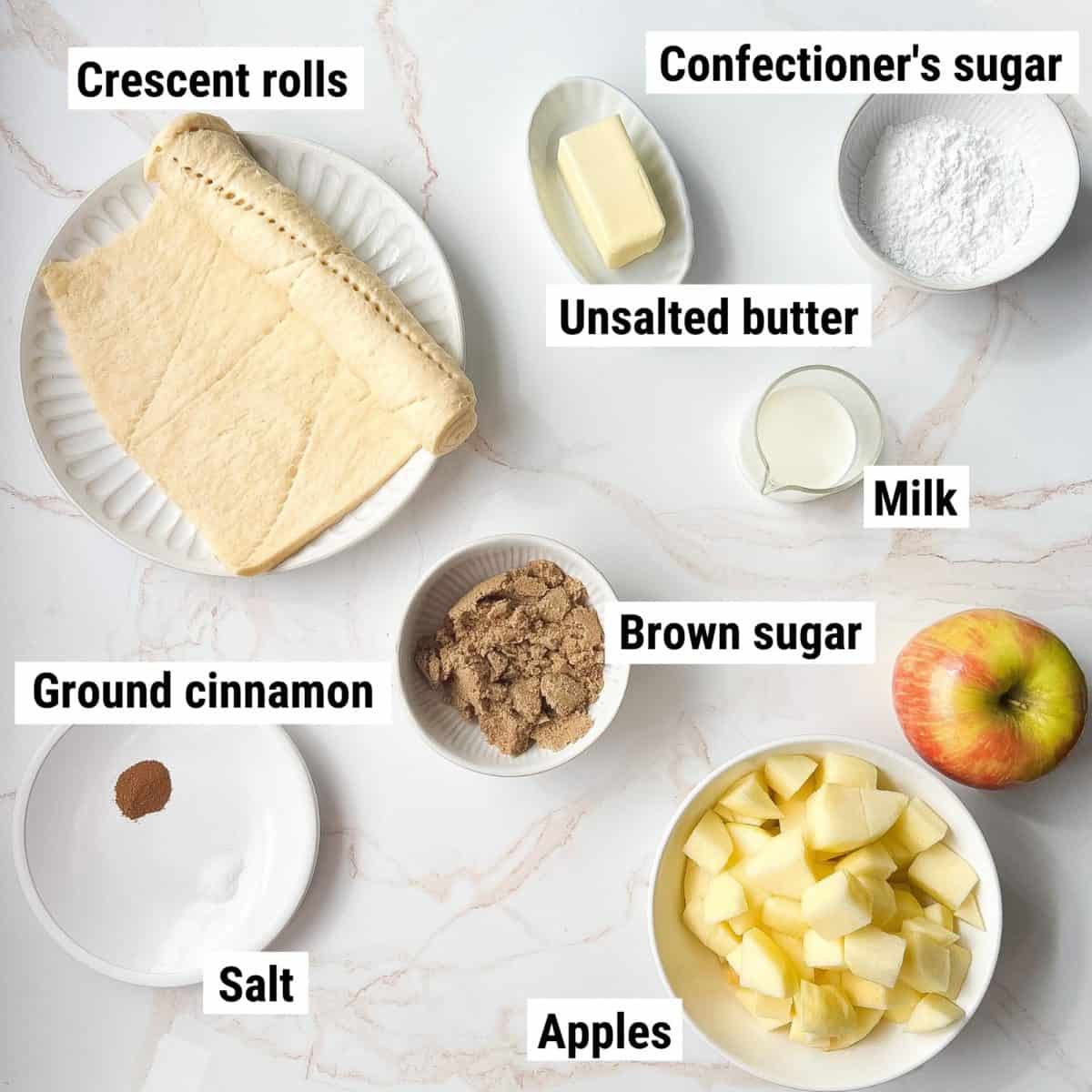 The recipe ingredients used to make apple danish spread out on a table.