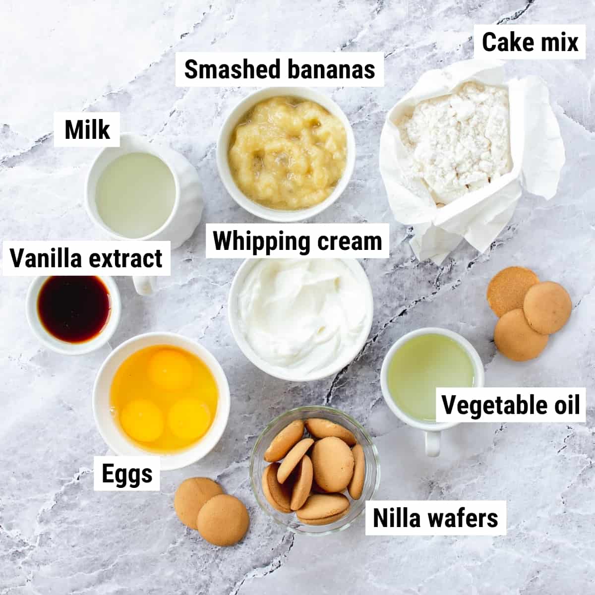 The ingredients used to make banana cream cupcakes laid out on a table.