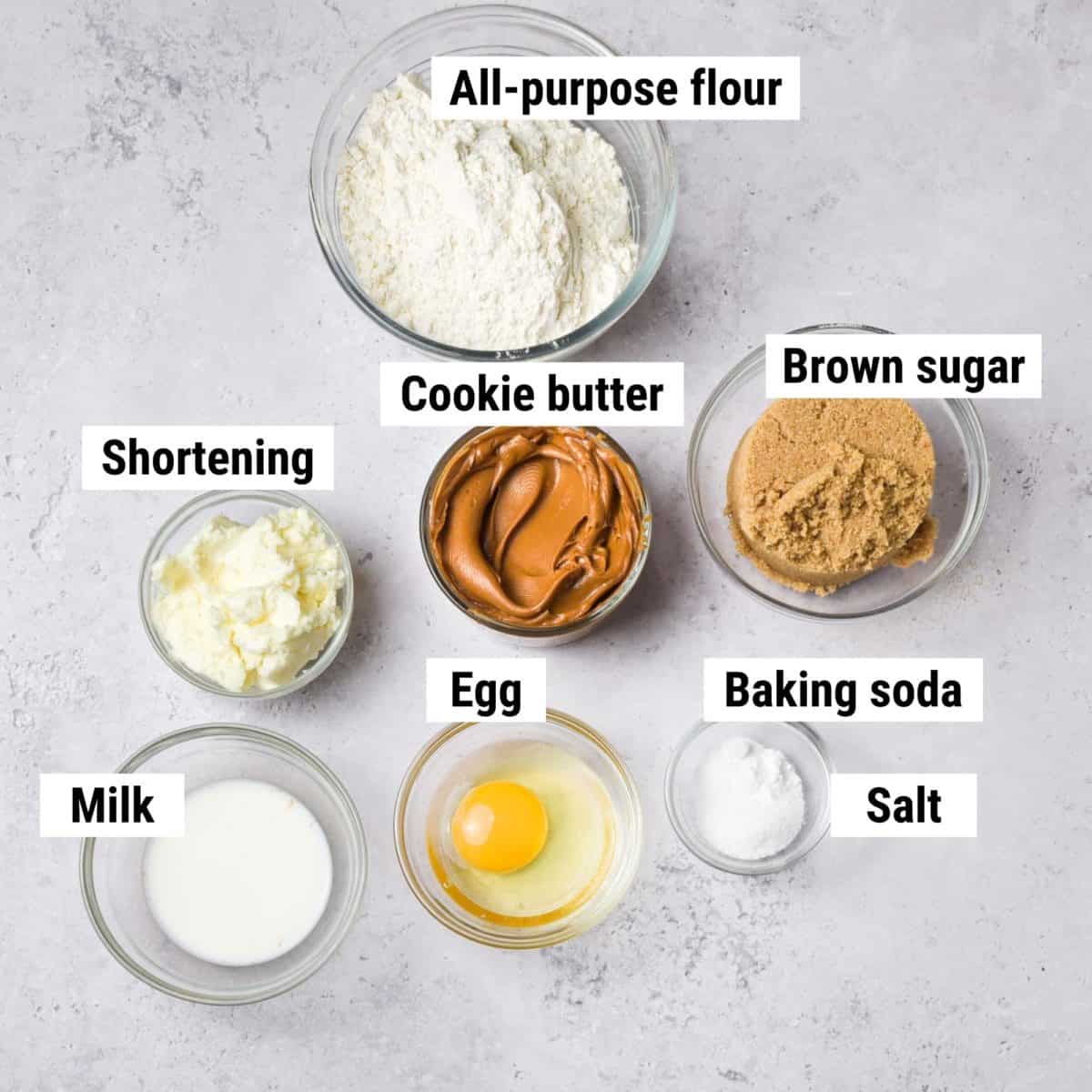 The recipe ingredients used to make Biscoff butter cookies laid out on a table.