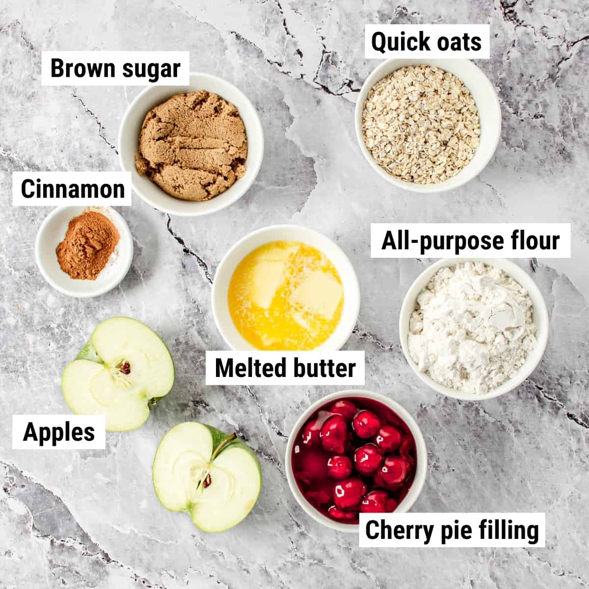 The ingredients to make cherry apple crisp laid out on a table.