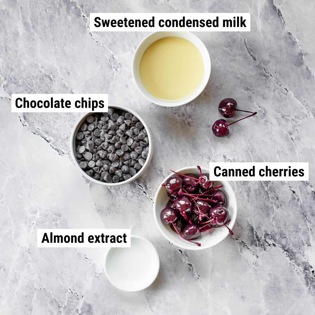 The ingredients to make chocolate cherry fudge laid out on a table.